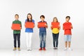 Group of children with red banners isolated in white Royalty Free Stock Photo
