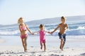 Group Of Children Running Along Beach In Swimwear Royalty Free Stock Photo