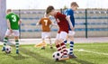 Group of Children Running Soccer Balls on Training Grass Field Royalty Free Stock Photo