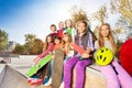Group of children with skateboards and helmet