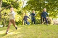 A group of children in spring field having fun Royalty Free Stock Photo