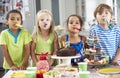 Group Of Children Standing By Table Laid With Birthday Party Food Royalty Free Stock Photo