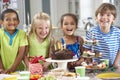 Group Of Children Standing By Table Laid With Birthday Party Food Royalty Free Stock Photo