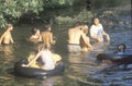 A group children swimming in a river near Ojai, CA