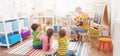 Group of children and teacher in the music class Royalty Free Stock Photo