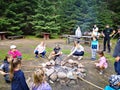 Group of children and their parents at a campfire on vacation in July 2019 in Latvia Royalty Free Stock Photo