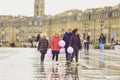 Group of children walking on water mirror