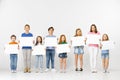 Group of children with a white banners isolated in white Royalty Free Stock Photo