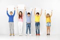 Group of children with a white banners isolated in white Royalty Free Stock Photo