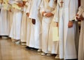 Group of children with white tunic during the religious rite of