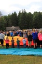 Group of children and young adults helping to roll out balloons at annual festival,Crandall Park, Glens Falls, New York,2014