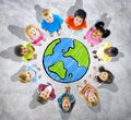 Group of Childrens around Globe in Grey Background Royalty Free Stock Photo