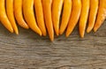 Group chilli yellow on wooden table Royalty Free Stock Photo