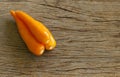 Group chilli yellow on wooden table Royalty Free Stock Photo