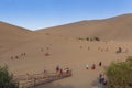 Group of Chinese tourists at the Crescent Moon Lake near the city of Dunhuang, in the Gansu Province, China. Royalty Free Stock Photo