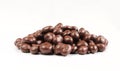 Group of chocolate covered raisins isolated on white background. Delicious sweet dragee Royalty Free Stock Photo