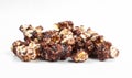 Group of chocolate popcorn isolated on white background. Delicious dessert Royalty Free Stock Photo