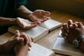 Group of christian people reading and study bible in home and pray together. Royalty Free Stock Photo