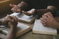 Group of christian people reading and study bible in home and pray together. Royalty Free Stock Photo