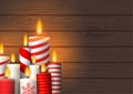 Group of Christmas burning candles on wood Royalty Free Stock Photo