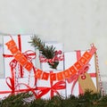 Group Christmas white gift boxes with red ribbons and garland Merry Christmas.