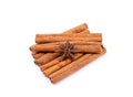 Group of cinnamon sticks with a single anise star. Royalty Free Stock Photo