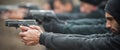 Group of civilian practice gun shooting on outdoor shooting range Royalty Free Stock Photo