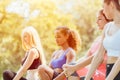 Group of teen woman mix race doing workout sport exercise warm up at outdoor park Royalty Free Stock Photo