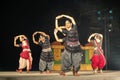 Group of Classical Odissi dancers performing Odissi Dance on stage at Konark Temple, Odisha, India. Royalty Free Stock Photo