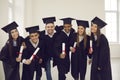 Group of classmates university graduates feeling happy with successful getting diplomas