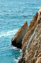 Group of cliff divers in free fly, Acapulco, Mexico. Royalty Free Stock Photo