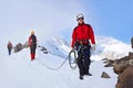 Group of climbers ascent to the mountain on a complex slope is composed of rock and snow Royalty Free Stock Photo