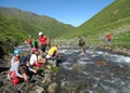 Group of climbers crossing river