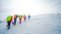 Group of climbers going to the top of mountain in winter Royalty Free Stock Photo