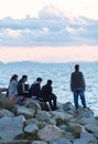 Group of close young friends watching the sunset in White Rock British Columbia