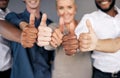 Group closeup, thumbs up and hands for business people by wall with emoji, diversity and insurance agency. Men, women Royalty Free Stock Photo