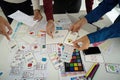 Design Process and Creative Input. Team examining design elements together to enhance digital user experience.