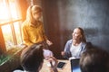 Group of colleagues having meeting in boardroom while working on big presentation and preparing their business strategy Royalty Free Stock Photo