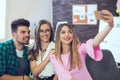 Group of colleagues taking a selfie Royalty Free Stock Photo