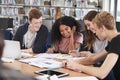Group Of College Students Collaborating On Project In Library Royalty Free Stock Photo