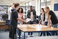 Group Of College Students Collaborating On Project In Library Royalty Free Stock Photo