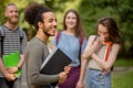 Group of college students latinamerican boy on foreground. Royalty Free Stock Photo