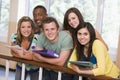 Group of college students leaning on banister Royalty Free Stock Photo