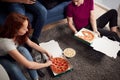 Group Of College Students In Shared House Having Night In Eating Pizza Together Royalty Free Stock Photo