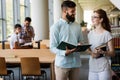 Group of college students studying at library Royalty Free Stock Photo