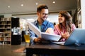 Group of college students studying in the school library. Royalty Free Stock Photo