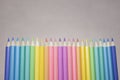 Group of color pencild laying in row striaght line made by pencil tips with grey background close up, Color pancils, copy space, Royalty Free Stock Photo