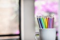 A group of color pencils in a white cup Royalty Free Stock Photo