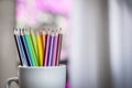 A group of color pencils in a white cup Royalty Free Stock Photo