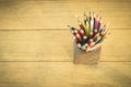 Group of color pencils in a wood cup Royalty Free Stock Photo